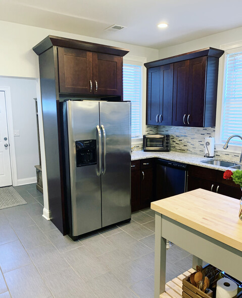 High end kitchen with stainless appliances and granite counter tops. - 74 Peters Pl