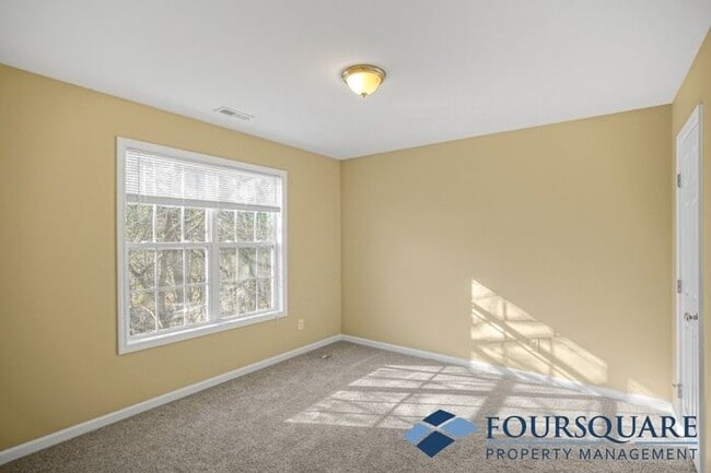 Building Photo - Charming 3-Bedroom Townhome with First-Floor Suite & Off-Street Parking – Near Capital Blvd & I-440
