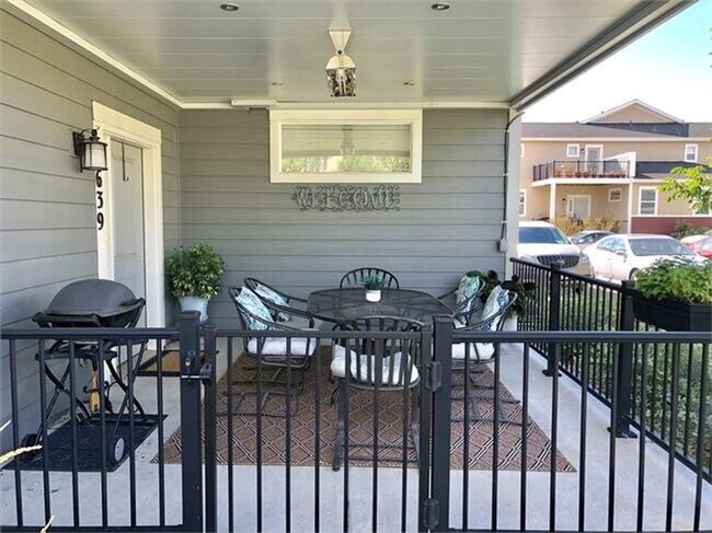 Building Photo - Four Bedroom Townhome with 2-car Garage Av...