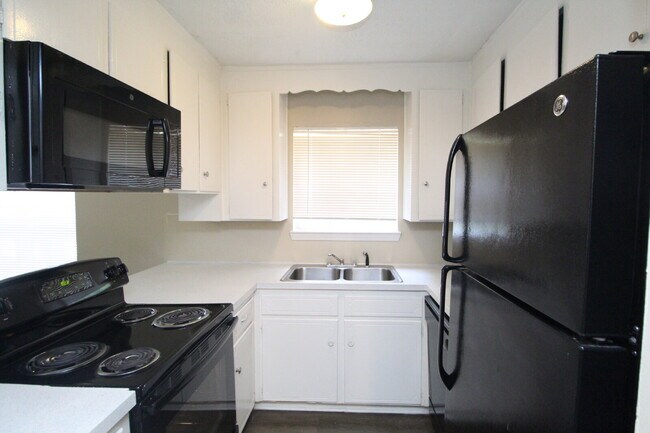 Building Photo - Don’t Miss This Updated First-Floor 1BR — Modern Upgrades, Easy Living & Prime Location Near 9 Mi...