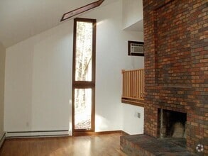 Building Photo - Spacious 3–4 Bedroom Home on Wooded Lot wi...