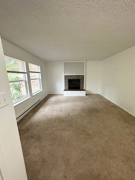 Living Room with Wood Fireplace - 3031 Bridgeport Way W