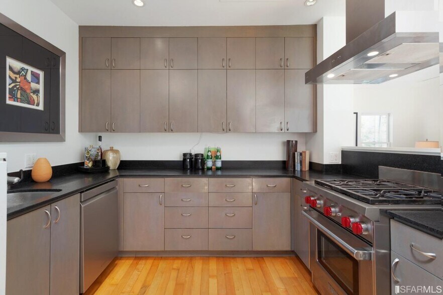 Large open kitchen with plenty of cabinets, Wolf gas range, dishwasher, & microwave - 328 Harriet St