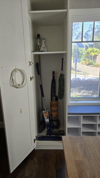 Utility cabinet includes Dyson vacuum, Bona floor cleaner and broom/dustpan - 10224 Aviary Dr