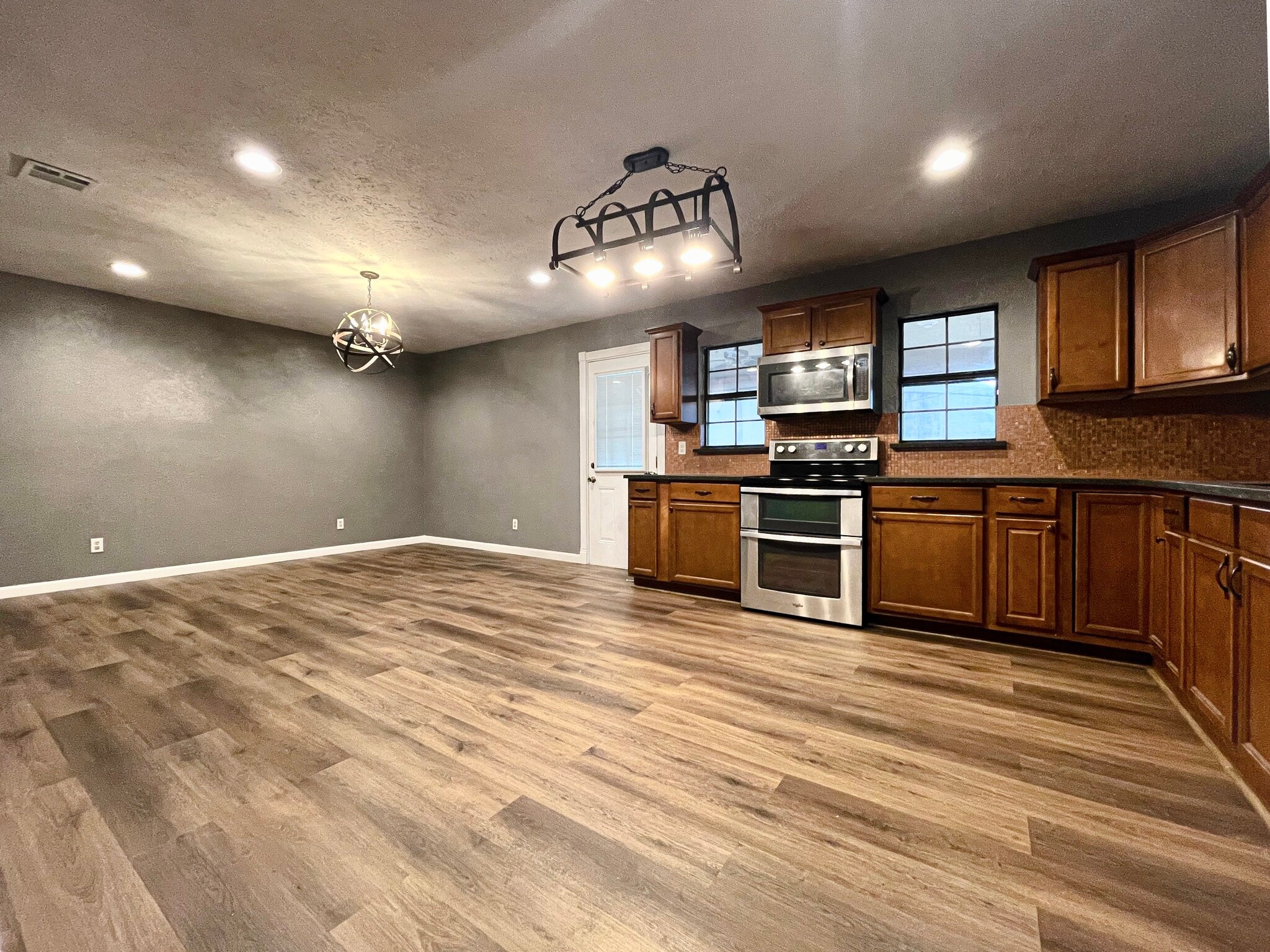 Dine-in area by kitchen with updated light fixtures - 7450 Emory Oak Ln