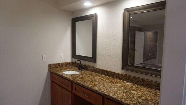 Building Photo - Four Bed - Three Bath - Large Storage Area...