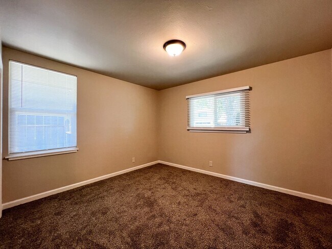 Building Photo - Freshly Renovated 3 Bedroom Home with Large Fenced Yard & Double Garage