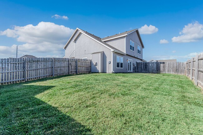 Building Photo - Fenced in backyard!