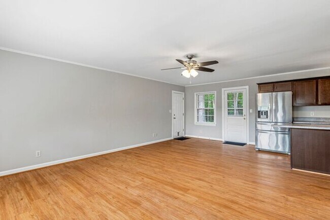 Building Photo - Updated Home, Stainless Steel Appliances, Wood Like Flooring, Deck, Garage!