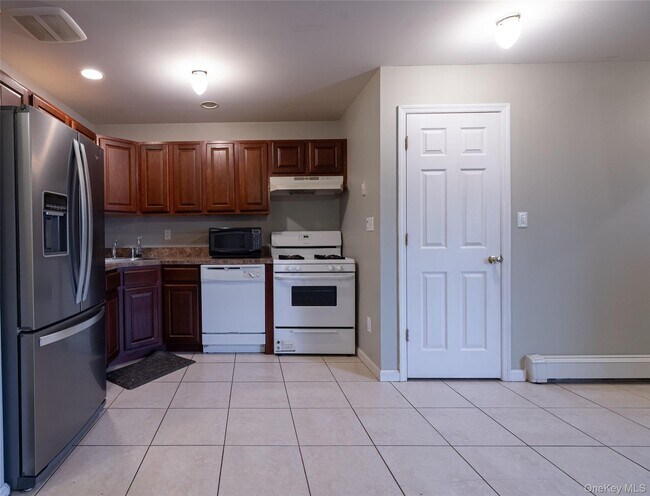 Building Photo - 62-21 Almeda Ave