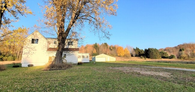 Building Photo - Renovated Farmhouse, 30+ Acres with Pole Barn!