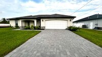 Building Photo - 4 Bedroom 2 Bathroom 2 Car Garage Home - NW Cape Coral - Available Mid April