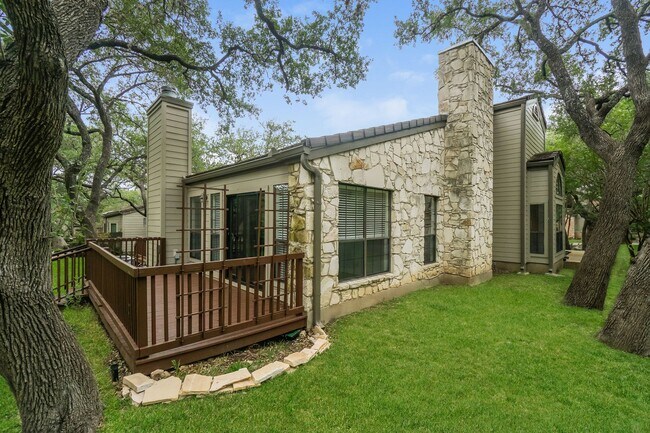 Building Photo - Charming 2-Bedroom Condo in Gated Community Surrounded by Mature Trees