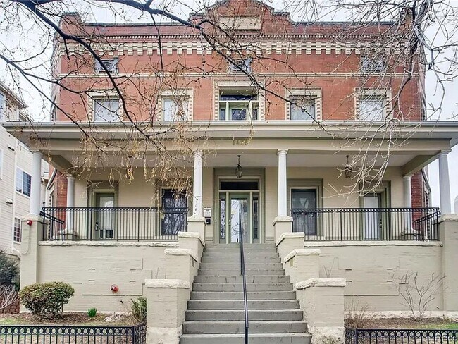 Building Photo - Large windows and exposed brick wall