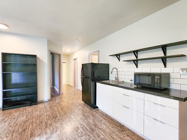 Building Photo - Vaulted Ceilings, Unique Designer Kitchen & Expansive Half-Acre Setting with Flexible Living Spaces