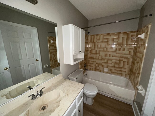 Building Photo - Charming 3BR/2BA Near Southwind | Hardwood Floors, Brick Fireplace, Bay Window & 2-Car Garage