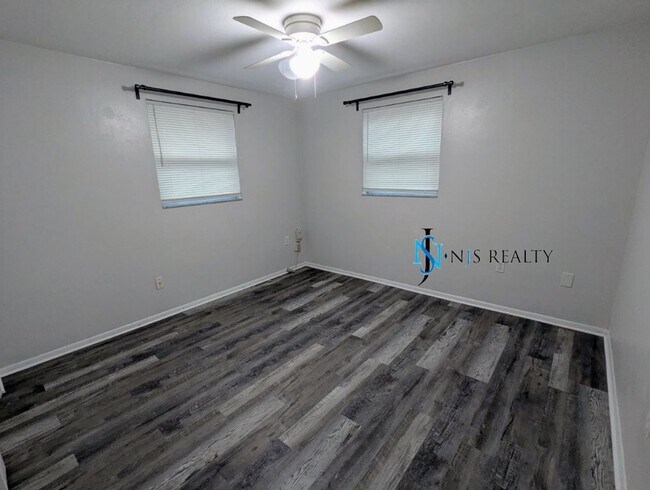 Building Photo - NEW FLOORS, NEW PAINT INSIDE & OUT.. 2/1/1...