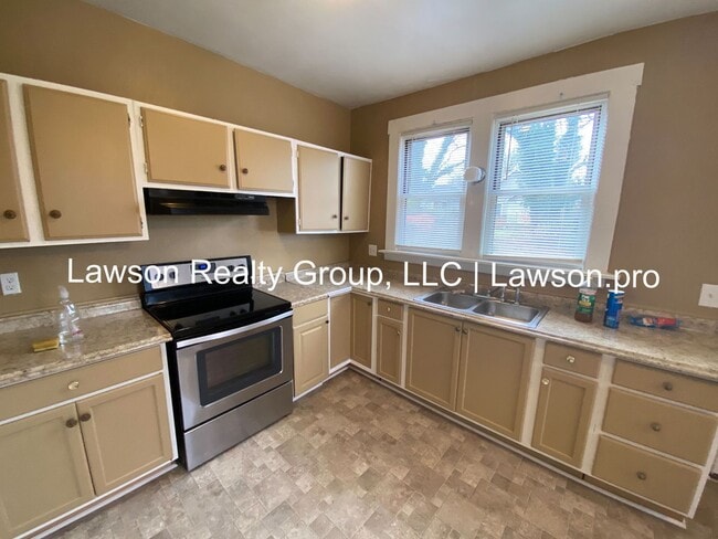 Building Photo - Updated Three Bedroom with Flat Yard