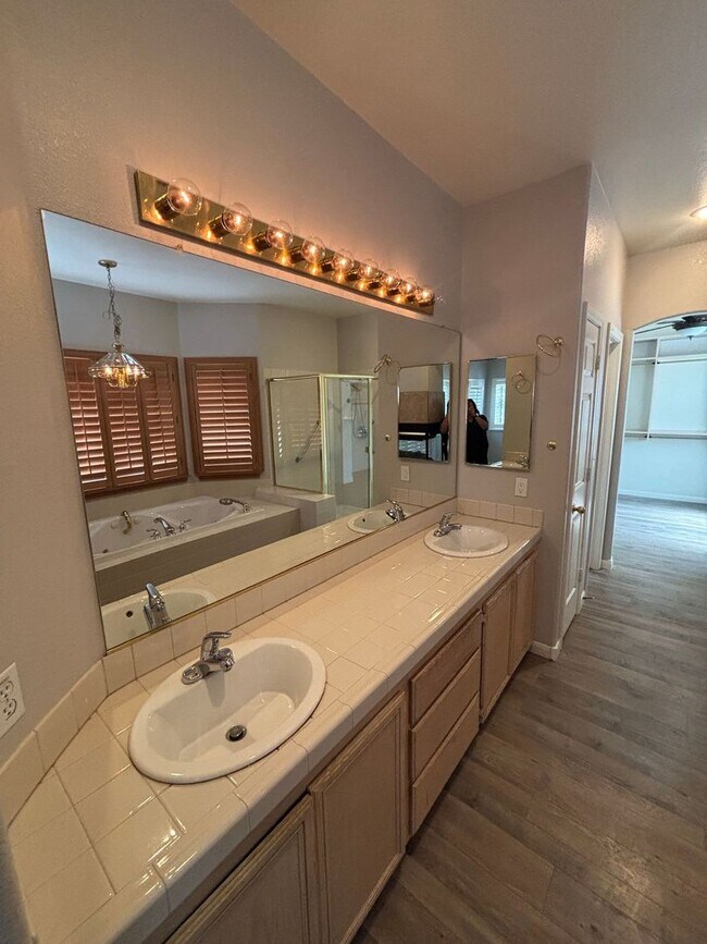 Building Photo - Gated Green Valley Ranch Townhome | 2 Bed | 2.5 Bath | 2-Car Garage