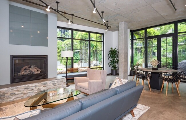 Building Photo - 1/2 Month FREE: Rare Streetcar Lofts Gem w/ Parking & Utilities