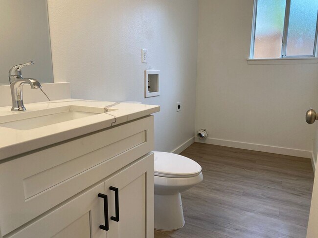 Building Photo - Stylishly Renovated Home with Private Back...