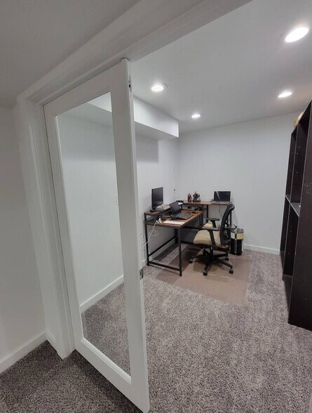 Private office with glass doors to see out to the living area. Perfect for the work-from-home parent - 11468 S Old Cedar Dr