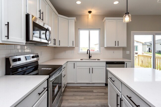 Building Photo - Spacious 4-Bedroom Home with 2-Car Garage & Yard