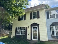Building Photo - This end unit townhome offers convenience and comfort, situated close to Manassas Park.