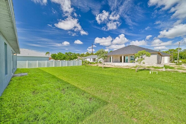 Building Photo - Spacious Three-Bedroom Home with Open Floor Plan, Large Yard