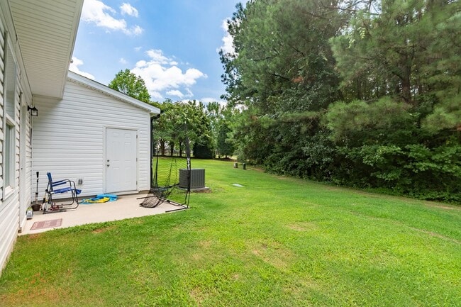 Building Photo - Modern 4 Bedroom Home in Quiet Clayton Nei...