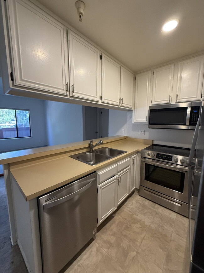 Building Photo - Spacious 3-Bedroom, 2-Bath Multi-Level Home with Balcony, In-Unit Laundry & Dual Parking