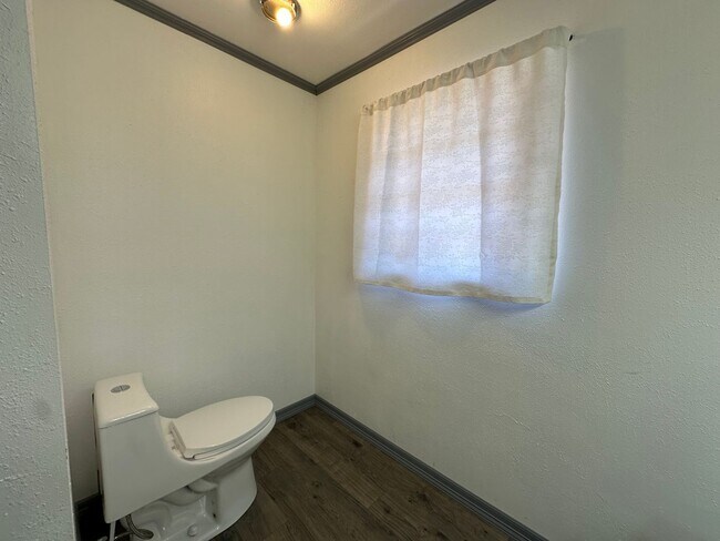 Building Photo - **COMING SOON ON JULY 1ST, 2026** Introducing a charming 3-bedroom, 2.5-bathroom home located in ...