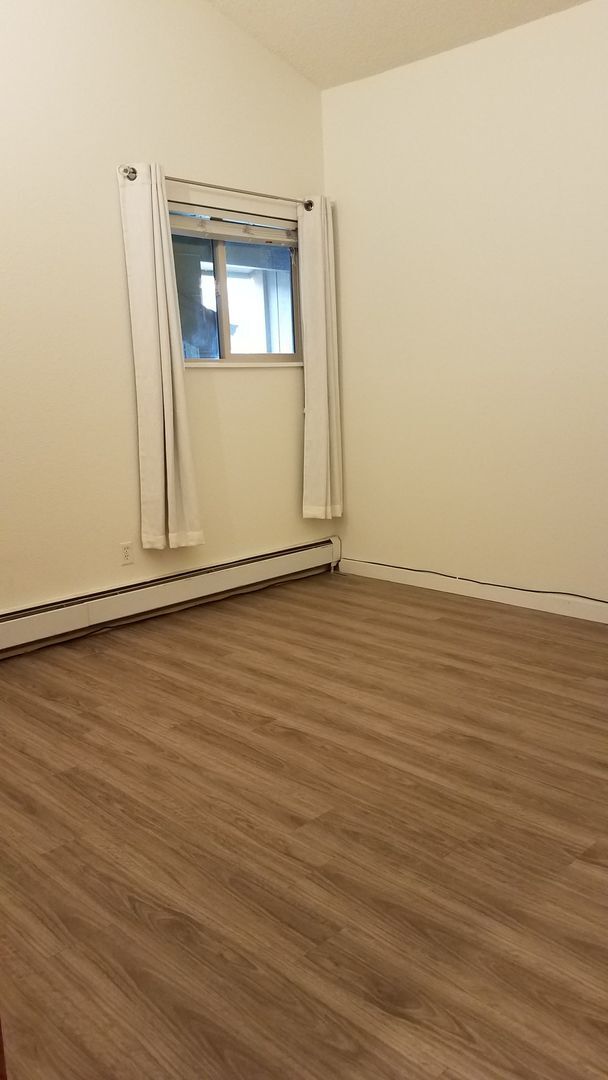 Building Photo - Year Lease 3 bedroom unit with Carport and...