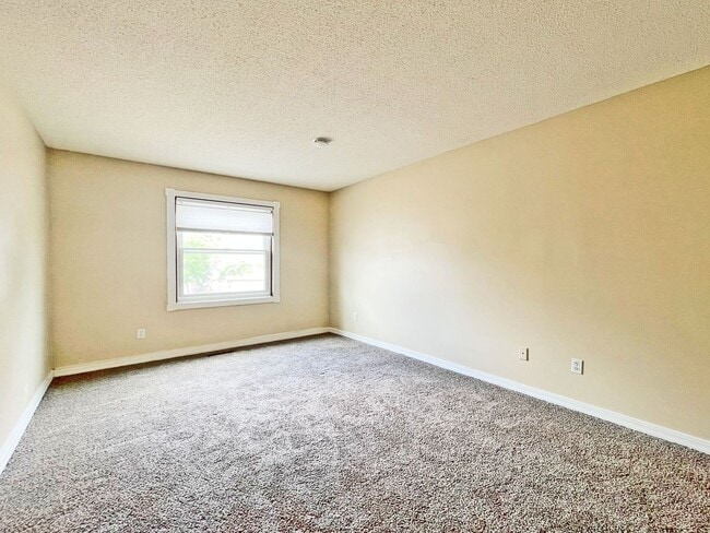 Building Photo - Beautifully Redone Modern Townhome with Large Deck, 2-Car Garage, Granite Kitchen, Vaulted Ceilin...