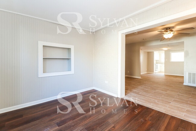 Building Photo - Venture outside to the expansive backyard,...