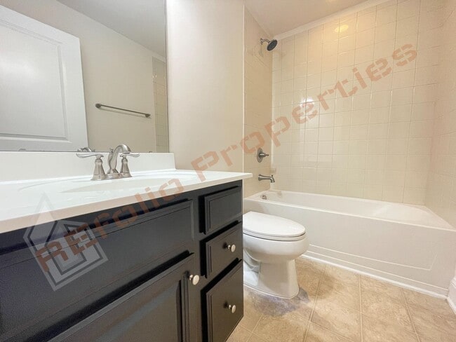 Building Photo - Beautiful 3 Story 3 Bedroom Townhouse with Huge 1st Floor Flex Space with Access to Patio + 2 Car...