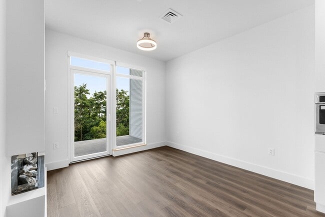 Building Photo - 2 Bedroom Corner-Unit with Wooded Balcony ...