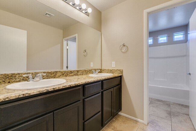 Building Photo - Spacious Townhouse with Loft & Rare 3-Car Garage!