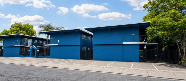 Building Photo - Corner & 1st Floor - Location, location, location! Become the newest neighbor at Palm Garden Apar...