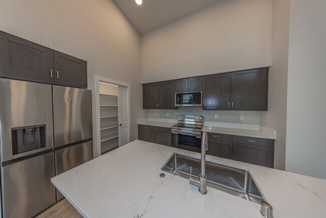 Building Photo - Brand New! - 2 Bedr in Gated Community - Free xfinity Internet