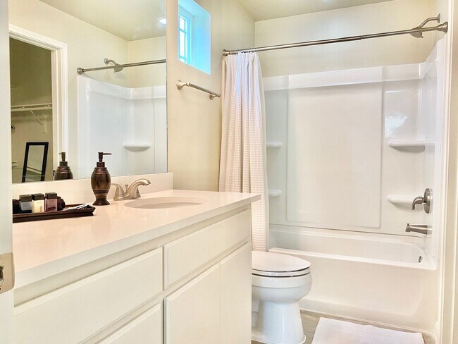 Building Photo - This charming two-story home, built in 2018, offers a spacious open floor plan perfect for casual...