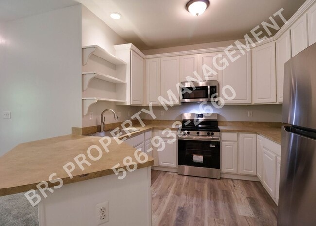 Building Photo - Move-In Ready 2BR Condo with Covered Garage in Harrison Township