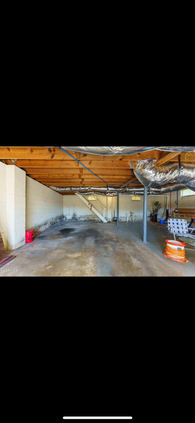 Unfinished basement with garage door - 1208 Pickwick Rd
