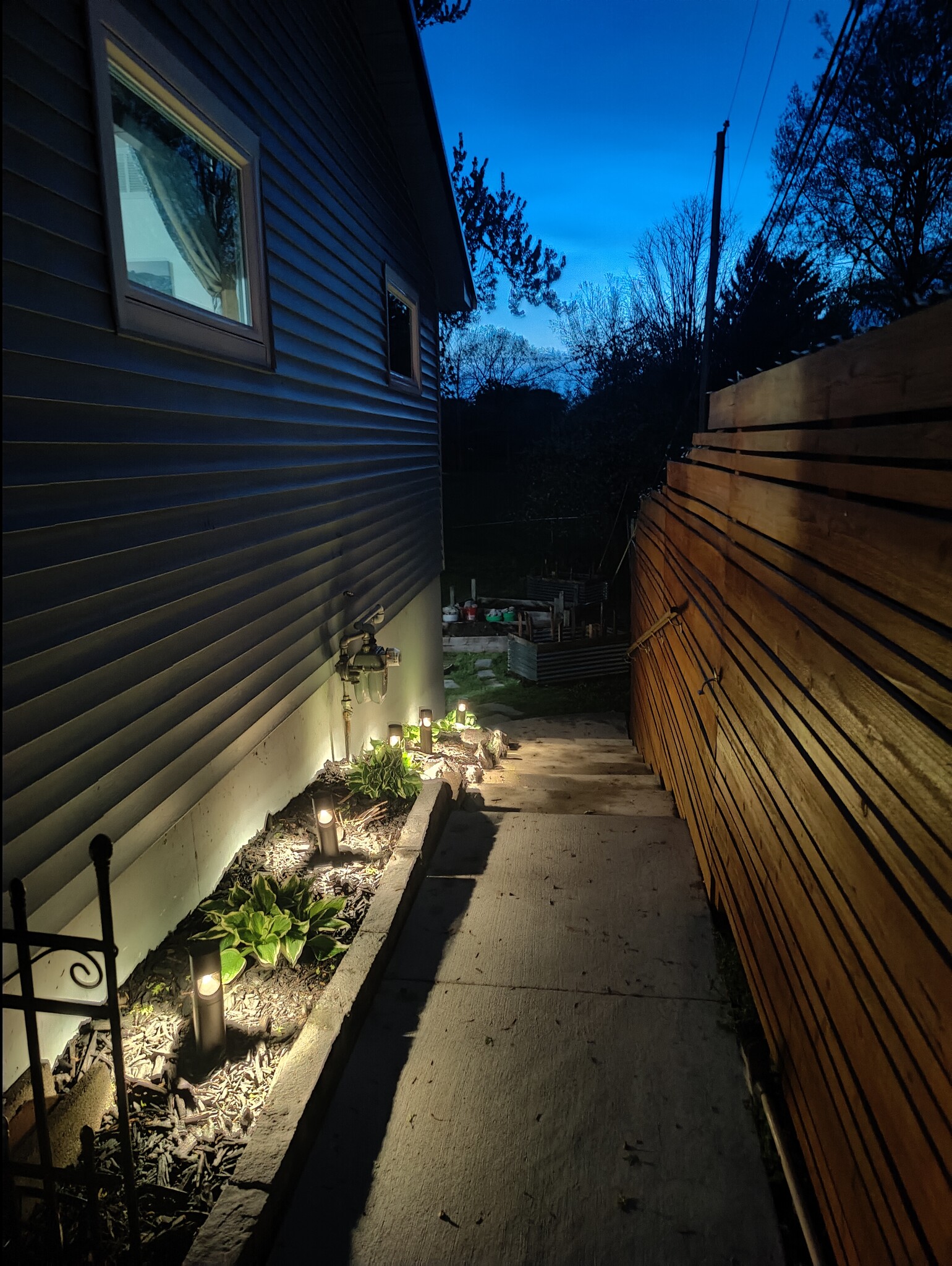 Dusk to dawn path lighting to private entrance - 2913 Clover St