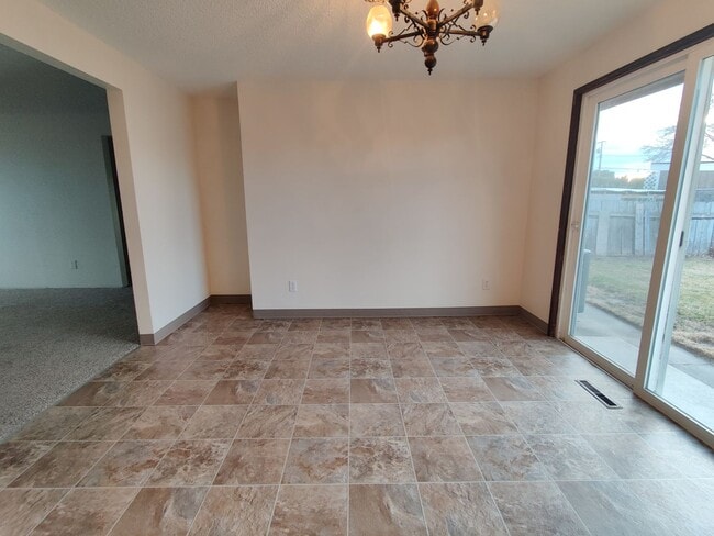 Building Photo - Duplex with garage and fenced yard and upd...