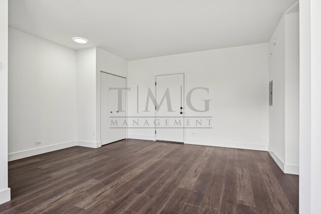 Building Photo - Sleek, Bright & Brand New — Stylish Studio...