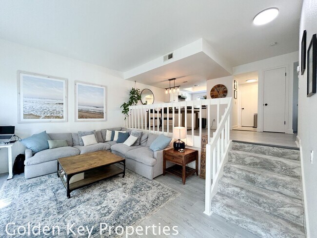 Building Photo - Welcome to this stunning ***unfurnished*** tri-level condo in the desirable Casitas de la Costa c...