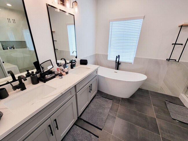 Building Photo - This 4-bedroom, 3-bathroom, two-story residence comes with a generous two-car attached garage. Re...