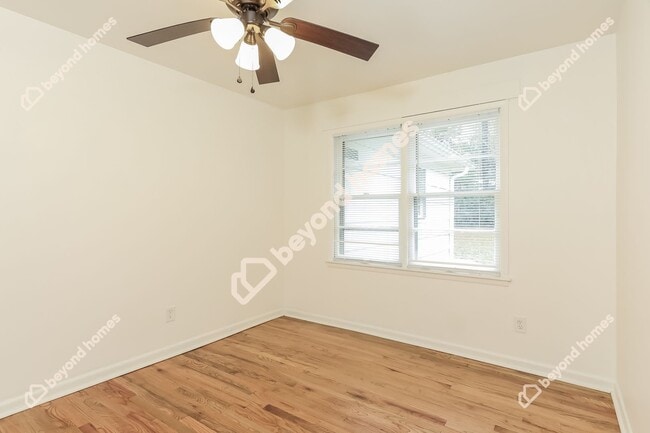 Building Photo - This Cozy 4 bedroom / 2 full bath and 2,09...