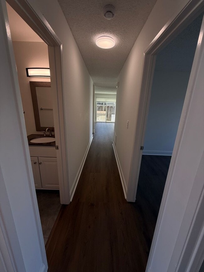 Building Photo - Recently updated home with new floors, paint & bathroom!